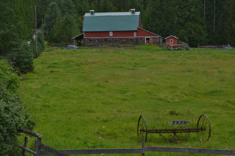 red barn on green pasture
